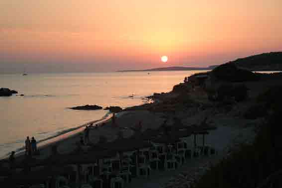 Sun setting behind Bini Gaus in the distance