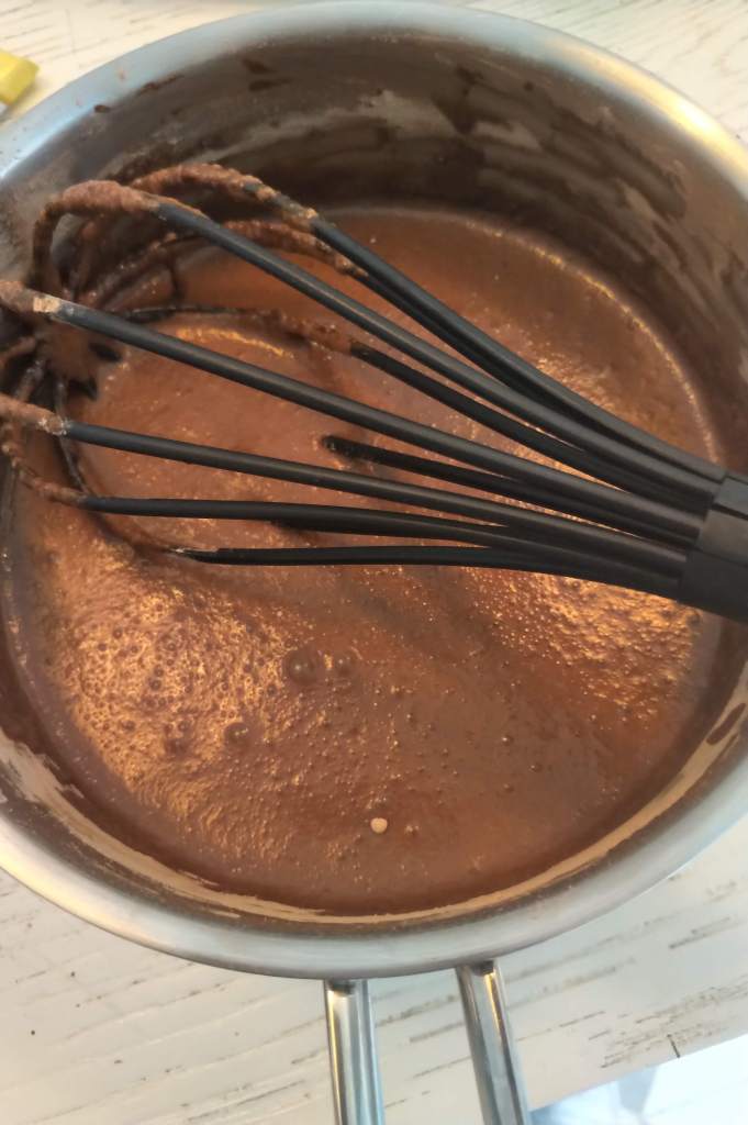 The process of making thick Spanish or South American drinking cacao. 