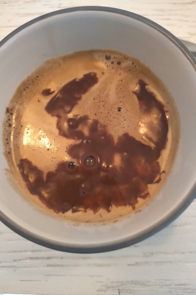 A cup of hot chcolate with espresso coffee. 